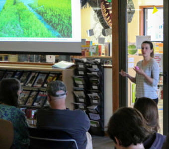 Lione Clare presenting her photo story to fellow Sitkans.