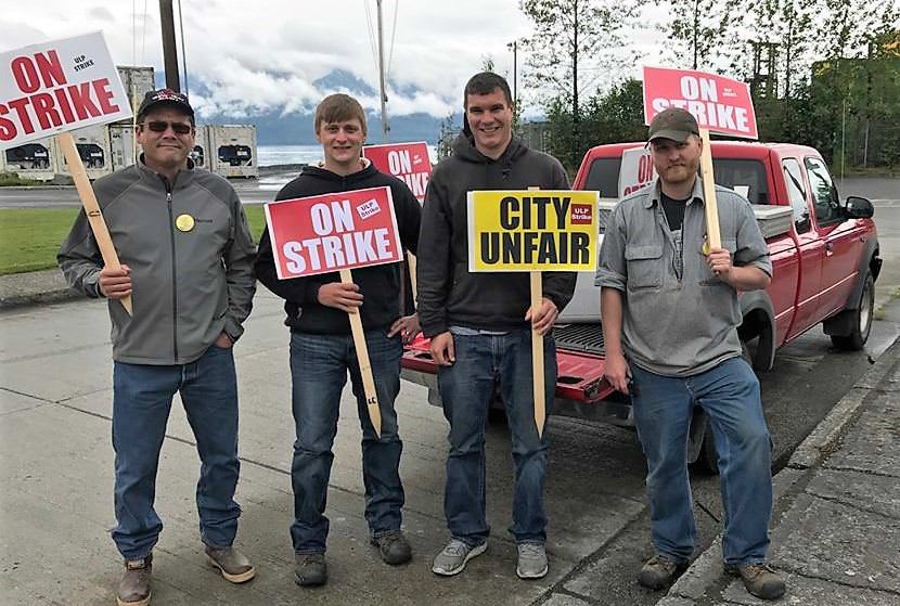 International Brotherhood of Electrical Workers representative Julius Matthew walked the picket line with Wrangell municipal workers Lorne Cook, Dwight Yancey and Andrew Scambler before the strike ended. (Photo courtesy IBEW)
