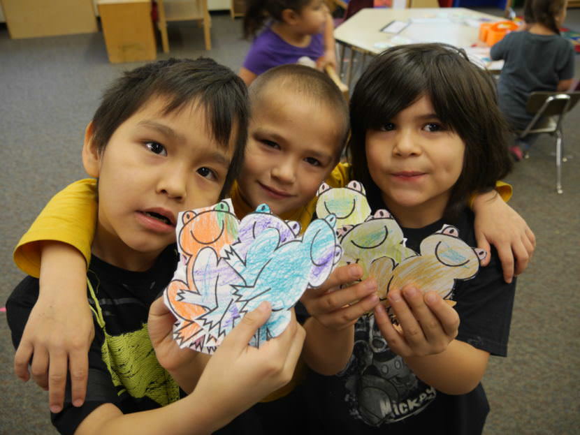 Hoonah City Schools kids showing off frogs they colored in January, 2017.