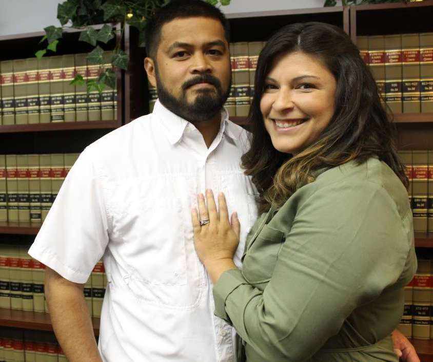 Gerry Realin (left) and his wife Jessica are working to get first responders workers' compensation benefits in Florida. (Photo by Abe Aboraya/WMFE)