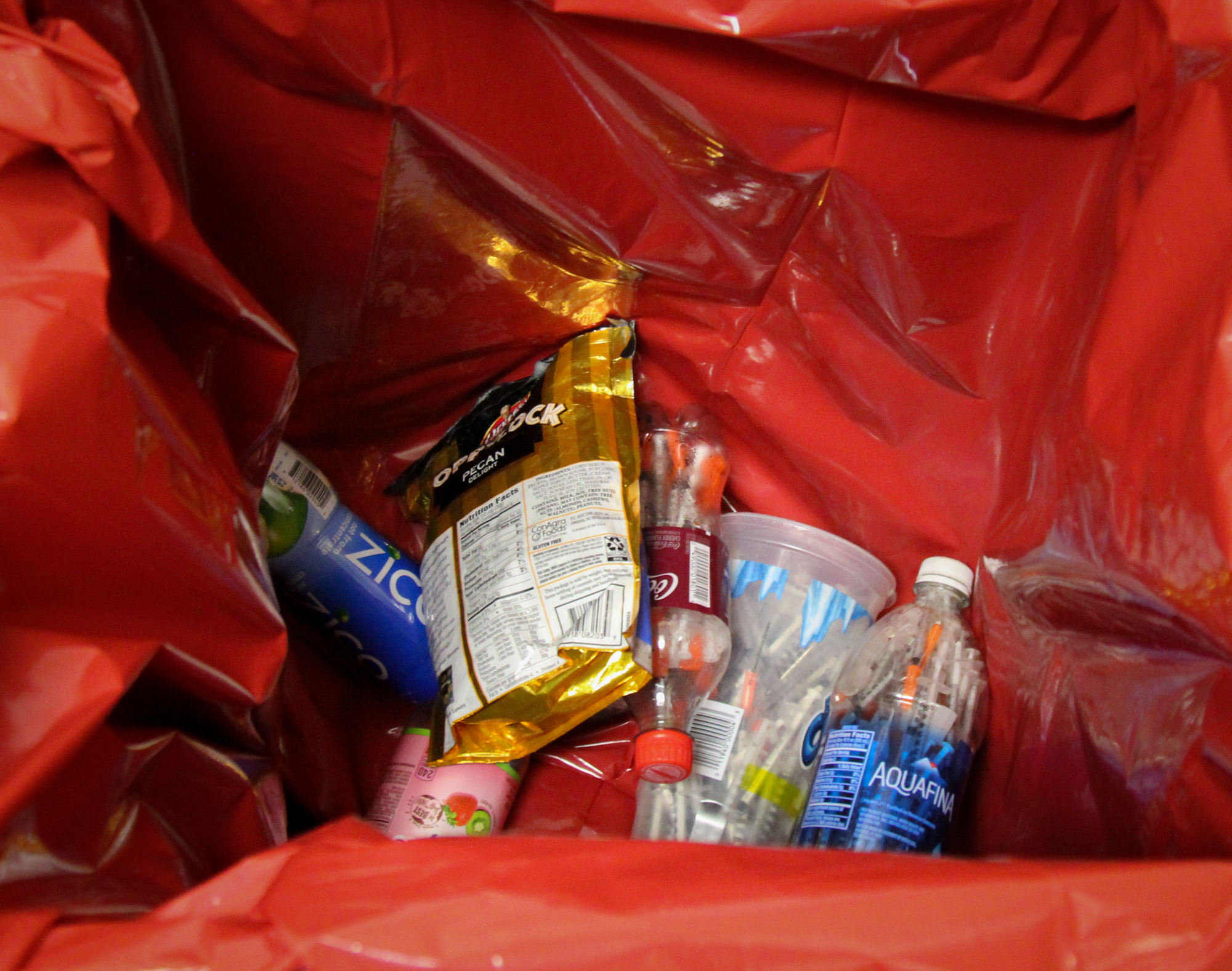Used syringes stored in puncture proof plastic drink containers disposed of at Alaska AIDS Assistance Association’s syringe exchange location in Anchorage (Photo by Zachariah Hughes/Alaska Public Media)