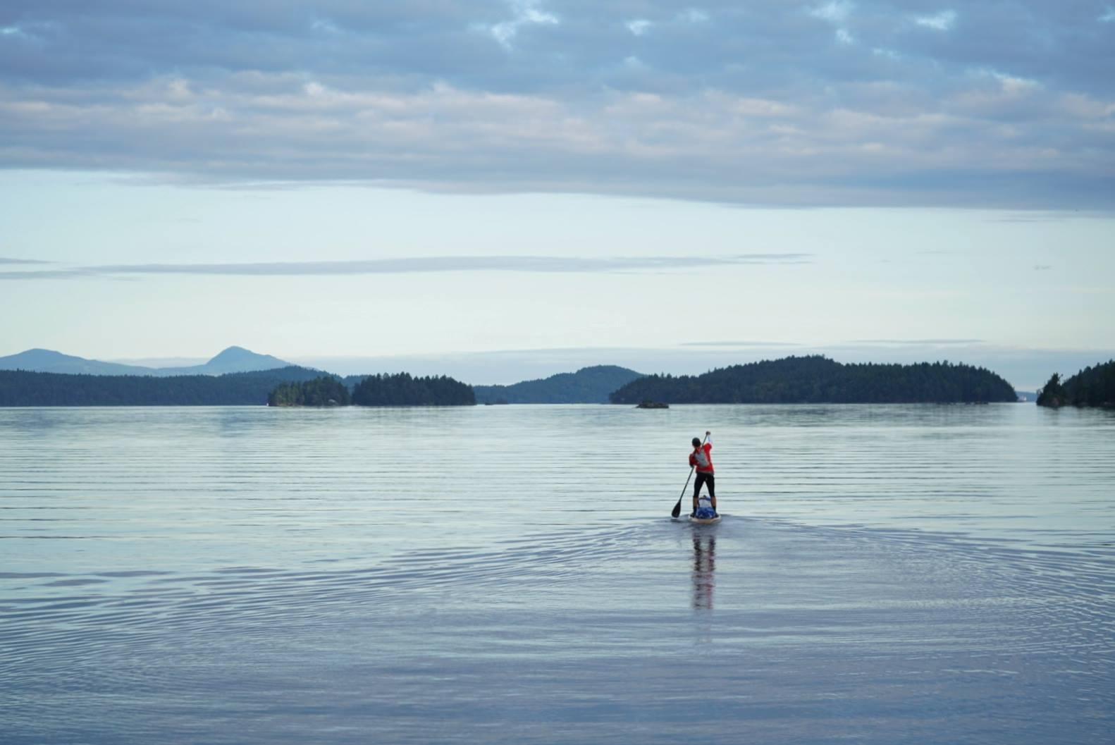 Karl Kruger paddles north through the Canadian Gulf Islands on June 12. (Photo courtesy Race to Alaska)