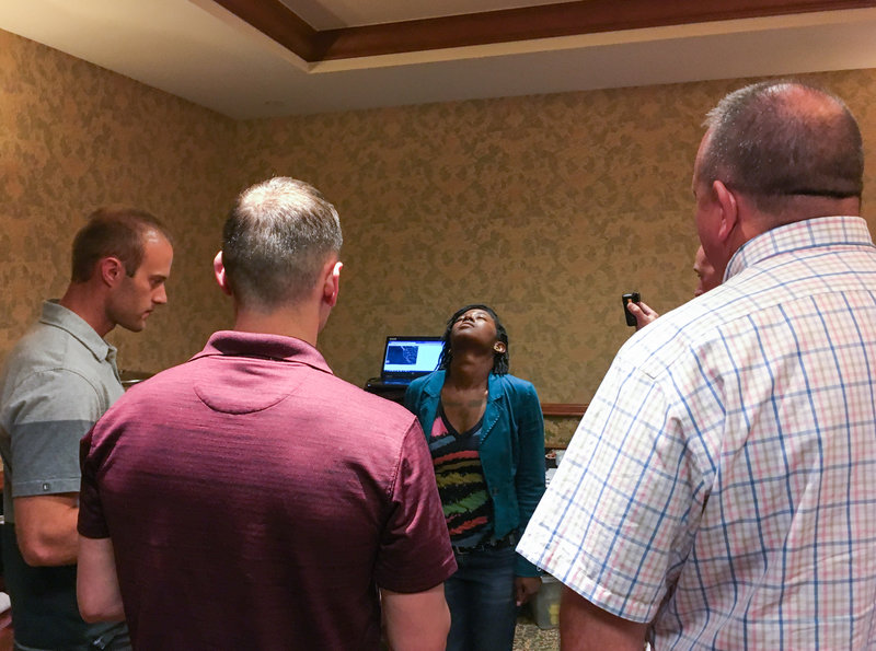 Volunteer Sharica Clark counts 30 seconds with her eyes closed, as officers with Colorado State Patrol check her balance and counting skills after using cannabis. It was part of a simulated roadside sobriety test in the officers' training seminar.