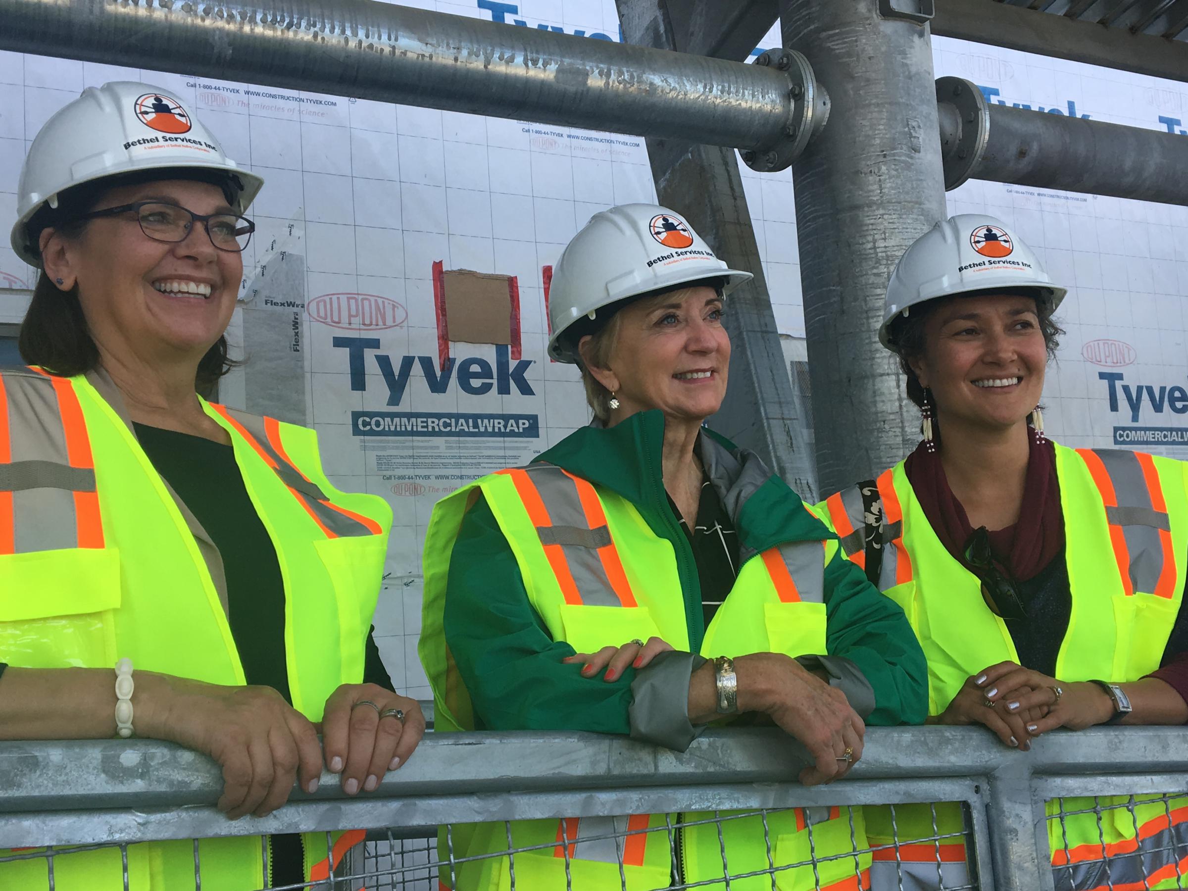 Small Business Administration Alaska District Office Director Nancy Porzio, left, tours Kwethluk school with former wrestling maven and SBA Administrator Linda McMahon and Ana Hoffman. (Photo by Teresa Cotsirilos/KYUK)