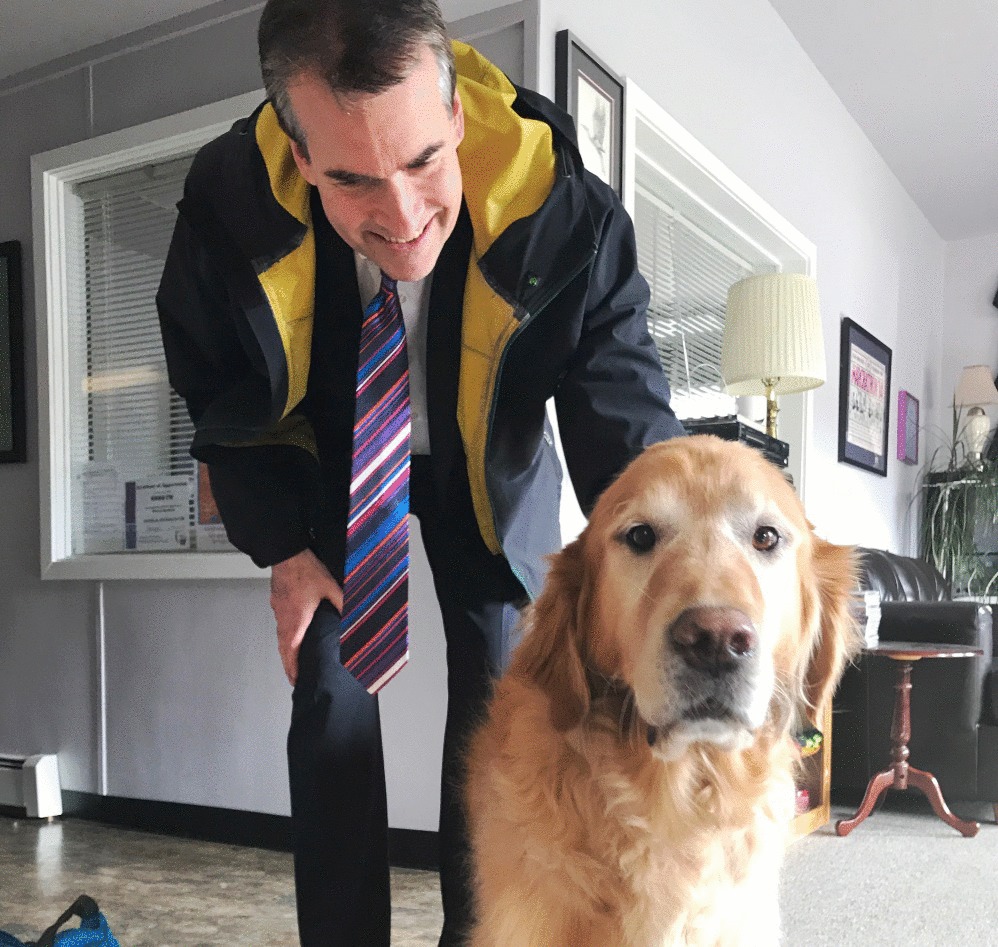 Alaska Bar Association President Darrel Gardner meets KRBD’s official greeter Monday. Gardner stopped by the station to talk about ABA outreach programs. (Photo by Krista Scully, ABA Pro Bono Director)
