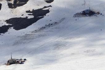 Rigs drill through snow into the Iron Cap deposit in July, 2017, as part of Seabridge Gold's KSM exploration project. (Photo courtesy Seabridge Gold)