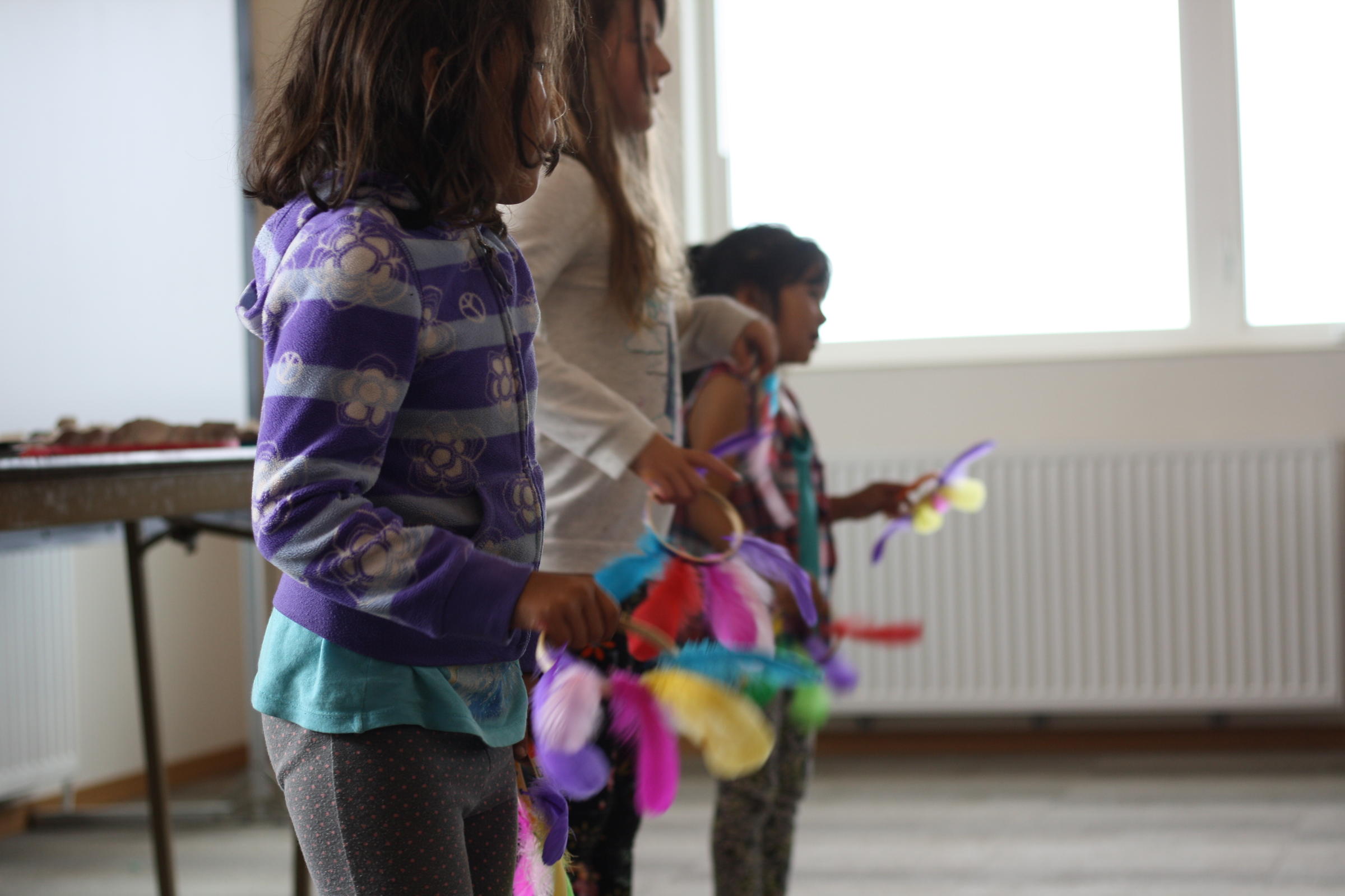 Clark's Point kids practice a traditional dance at summer culture camp. On August 21, they will be students at the village school. (Photo by Avery Lill/KDLG)