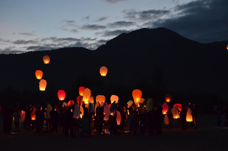 Community members released sky lanterns July 4, 2016, following a fatal crash that led to the cancellation of Petersburg’s Independence Day celebration that year. (Photo by Orin Pierson/KFSK)