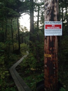 No trespassing signs mark a popular trail at the end of North Douglas Highway on Sept. 28, 2017. The signs were recently re-posted at the request of landowner Goldbelt, Inc.