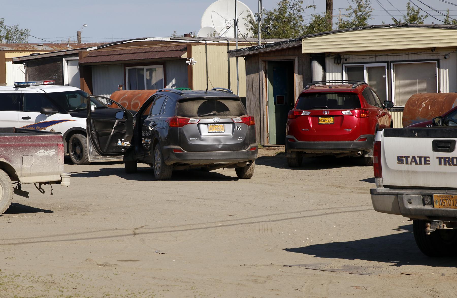 Alaska Troopers search homes and cabs in Bethel's Trailer Court, on June 7, 2016, looking for evidence of illegal alcohol sales. (Photo by KYUK)