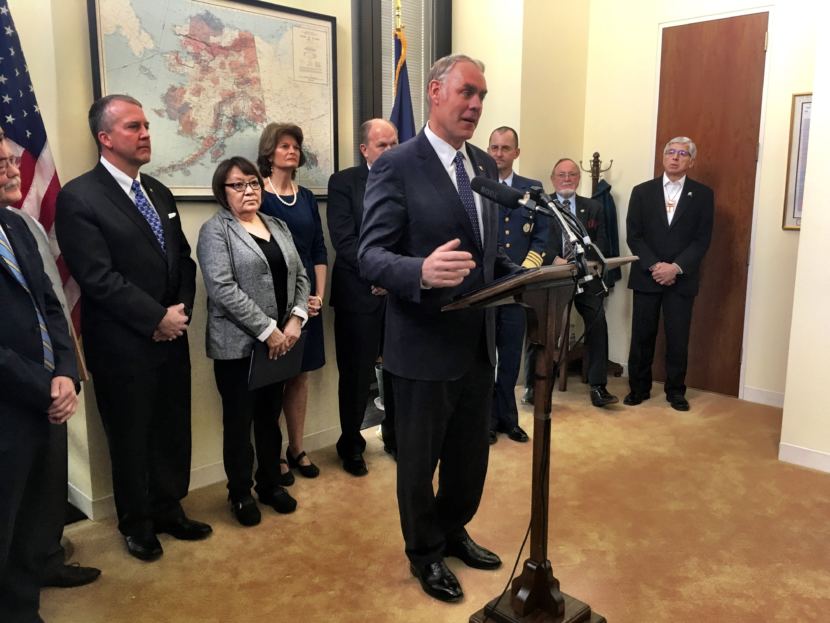 Interior Secretary Ryan Zinke announces the King Cove road deal on Jan. 22, 2018. Behind him is Della Trumble of King Cove, flanked by Sens. Dan Sullivan and Lisa Murkowski.