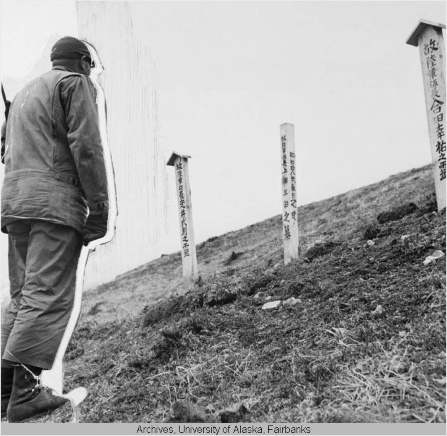 An American solider look at a Japanese graveyard. (Alaska and Polar Regions Collections, Elmer E. Rasmuson Library, University of Alaska Fairbanks)