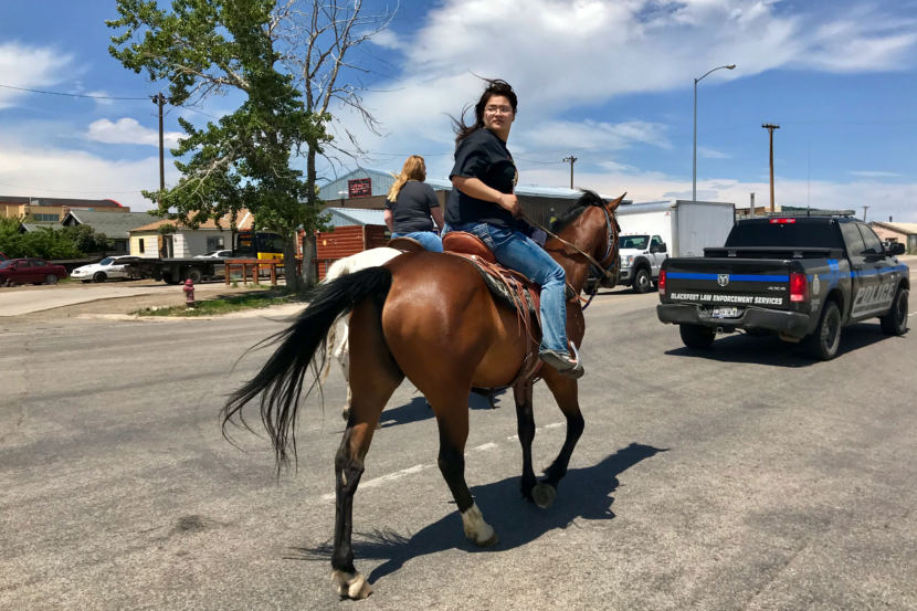 Jonnilyn Loring leads a group of marchers down the main highway in Browning, Mont. (Photo by Nate Hegyi/Yellowstone Public Radio)