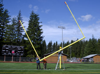 After the uprights are added the crossbar is rotated back to a level position.