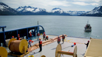 Trainees with Royal Dutch Shell learn to deploy oil spill booms in the waters near the port of Valdez in Alaska. The company is training about 200 spill responders. (Photo by Richard Harris/NPR)