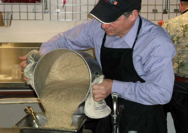 Greg Regester from NANA Management Services prepares a breakfast of Cream of Barley grown in Delta Junction for Juneau students.