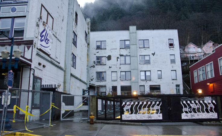 Caution tape blocks off the sidewalks around Gastineau Apartments.