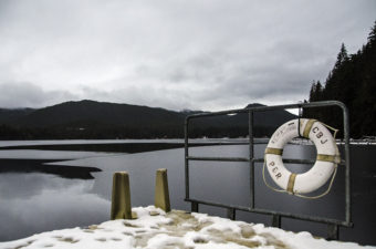 A CBJ Parks and Rec life ring hangs on the floating dock at Auke Lake.