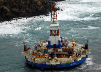 The conical drilling unit Kulluk sits grounded 40 miles southwest of Kodiak City, Thursday, Jan. 3, 2012. The Kulluk grounded after many efforts by tug vessel crews and Coast Guard crews to move the vessel to safe harbor during a winter storm. PETTY OFFICER 2ND CLASS ZACHARY PAINTER — U.S. Coast Guard