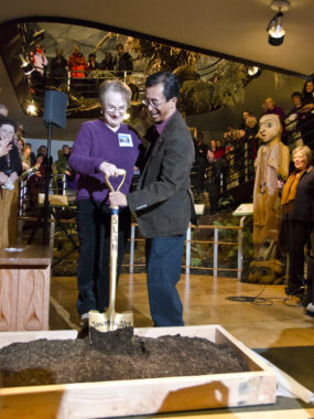 Phyllis DeMuth, member of the 1967 Alaska State Museum Committee, and Ron Inouye, representative of the Alaska Historical Society break ground.