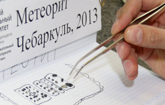 Researchers who studied pieces of the meteor collected near Lake Cherbarkul say it was a common chondrite meteor. The largest of the 53 fragments was one centimeter in diameter. Photo provided by the Urals Federal University Press Service. Alexander Khlopotov/AP