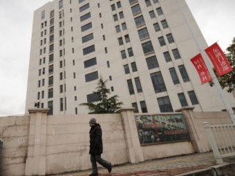 Cyberattack headquarters? The 12-story building in a Shanghai suburb that American investigators say houses an operation responsible for hundreds of cyberattacks on companies around the world. Peter Parks /AFP/Getty Images