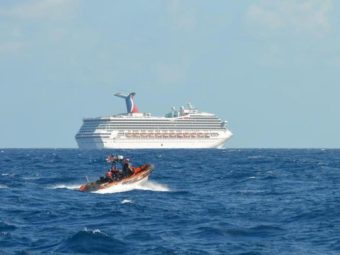 The Triumph cruise ship, set adrift in the Gulf of Mexico after an engine room fire Sunday, is being towed to Mobile, Alabama. The Carnival cruise ship line has cancelled the ship's next 14 voyages. (Photo by U.S. Coast Guard)