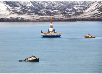 The anchor-handling vessel, the Aiviq, tows the drilling unit Kulluk to a safe harbor location in Kiliuda Bay, Alaska on Jan. 7, 2013. Photo by U.S. Coast Guard Petty Officer 3rd Class Jonathan Klingenberg.