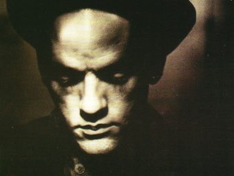 Michael Stipe broods on the cover of R.E.M.'s "Losing My Religion" single. Earlier this year, a remarkably cheery-sounding major-key version of the song appeared online. Album cover