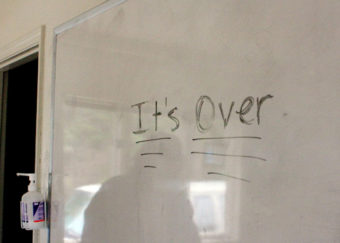 It's over is written on a white board inside the house where clients lived during their stay at the residential treatment program.