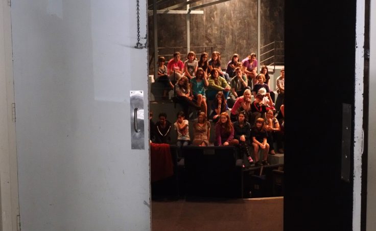 a picture of students through a door