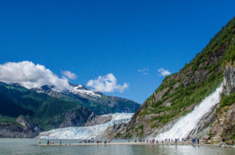 Tourists and residents take in the sun at Nugget Falls.