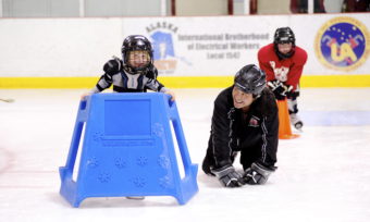 Darryl Tseu (right) shares a laugh with Kate Bovitz who participated in JDIA’s Learn to Play event Saturday.