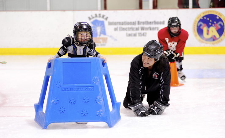 Darryl Tseu (right) shares a laugh with Kate Bovitz who participated in JDIA’s Learn to Play event Saturday.