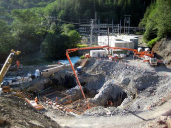 An enormous concrete pump truck pours footings at the new Blue Lake powerhouse. The rig can place 500 yards a day. (Blue Lake Expansion Project photo)