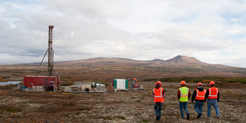 Members of the media walking to an exploratory drill rig. Photo by Jason Sear, KDLG – Dillingham
