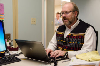 Enroll Alaska agent Mike Clark is stationed at Bartlett Regional Hospital. (Photo by Heather Bryant/KTOO)
