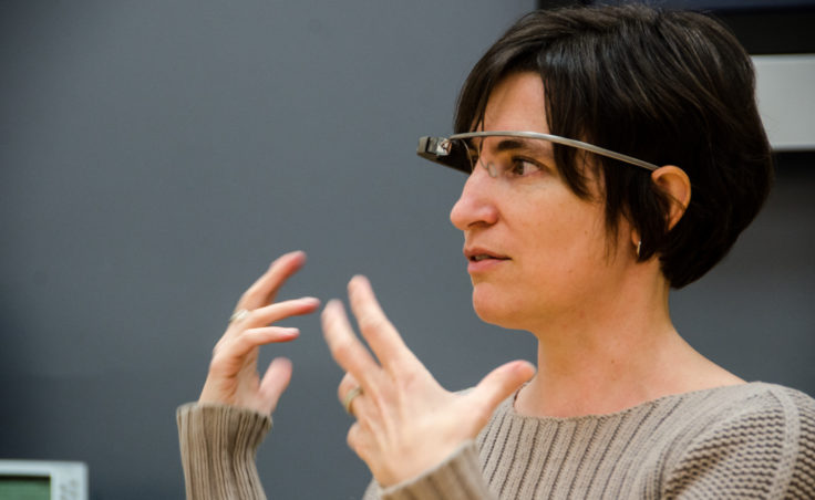 Instructional Designer Jennifer Moss demonstrates how Glass works. (Photo by Heather Bryant/KTOO)