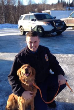 Trooper Lucas Hegg with Amber. (Photo courtesy Alaska State Troopers)