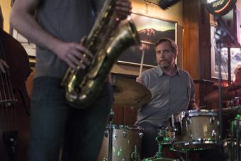 a man plays drums