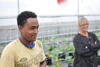 Diwt Gerewakl and Debbie Bacho in a P&M Gardens greenhouse. (Photo by Anne Hillman/KSKA)