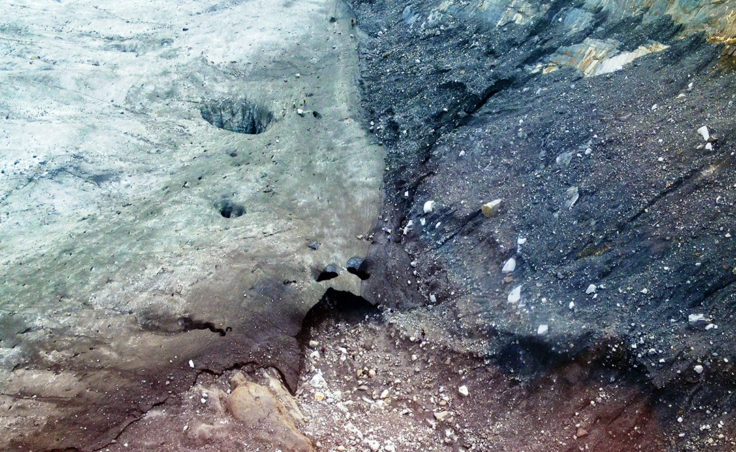 The entrance to the ice cave shows deterioration. Holes have begun appearing in the cave roof. (Photo by John Neary)