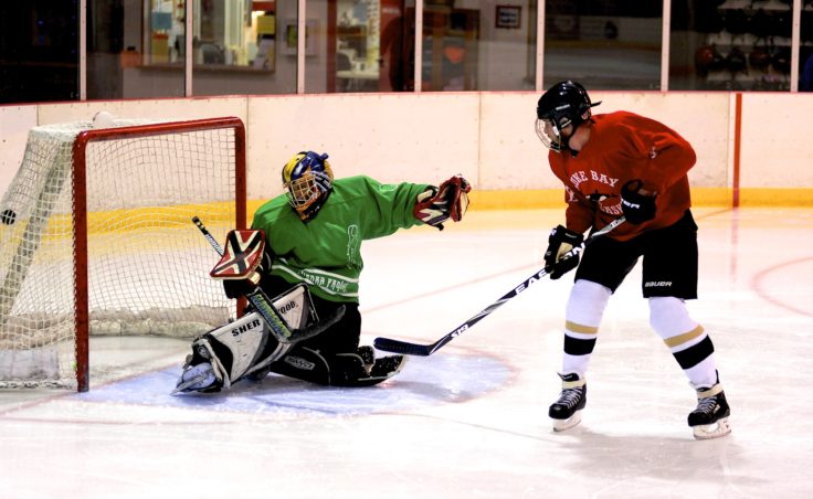 Killer Whales Eric Scott successfully converts a breakaway on Mark Sebastian during a recent game versus the Winnipeg Rifles.