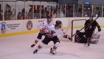 Juneau’s Ryan Liebelt reacts to putting the Bears on top with the first of his two goals in Friday night’s game won by Juneau, 5-2.