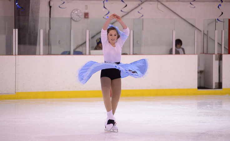 Katie McKenna spins to Rockin’ Around the Christmas Tree during the Juneau Skating Club’s holiday recital at Treadwell Ice Arena.