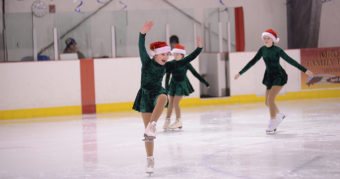Abigail Laurent punctuates a team performance to the song We Need a Little Christmas.