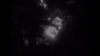 A Coast Guard MH-60 Jayhawk helicopter crew hoists a couple near Sitka, Alaska, Dec. 27, 2014. The passengers were taken to emergency medical personnel in Sitka. U.S. Coast Guard video provided by Air Station Sitka.