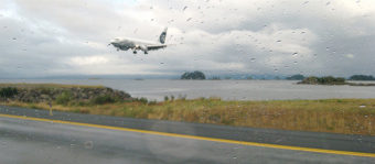 An Alaska Airlines jet touches down in Sitka. Both runway approaches are over ocean. (Flickr photo/Pat Groves)