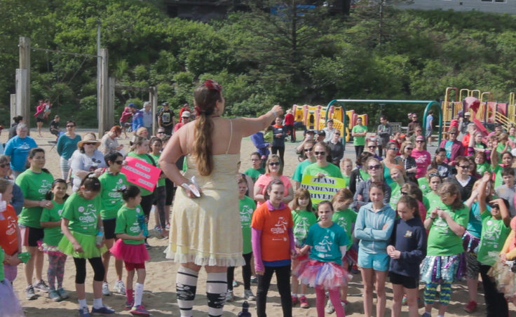 Council Director Ati Nasiah addresses the girls before the run (Photo by David Purdy/KTOO)