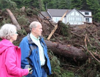 Gov. Bill Walker (right) and Sitka Mayor Mim McConnell visited the site of the Kramer Avenue landslide on Wednesday, Aug.19. (Photo by Rachel Waldholz/KCAW)